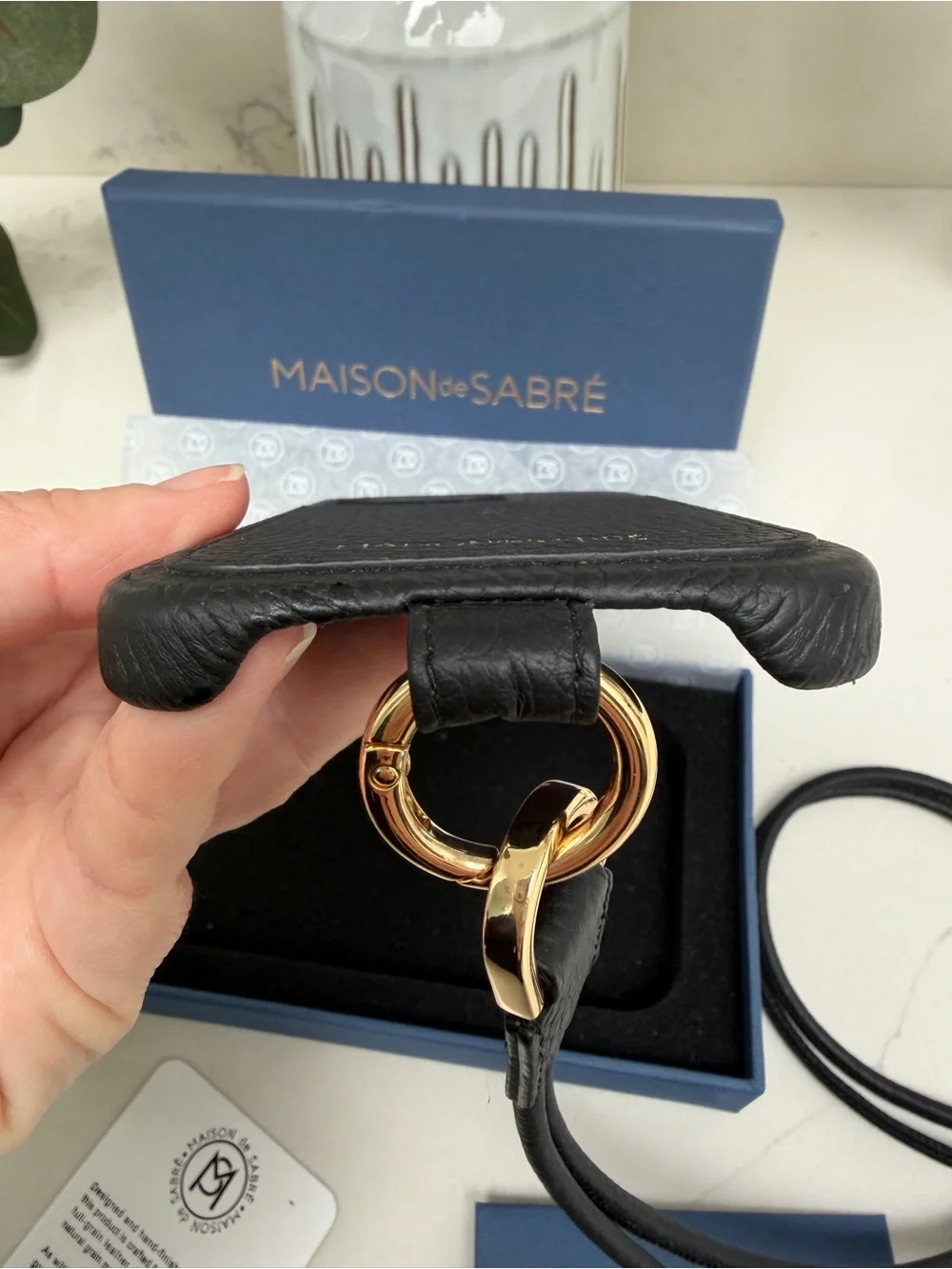 Maison de Sabre Sling Phone Case iPhone 14 Pro in Black Caviar and Gold Hardware